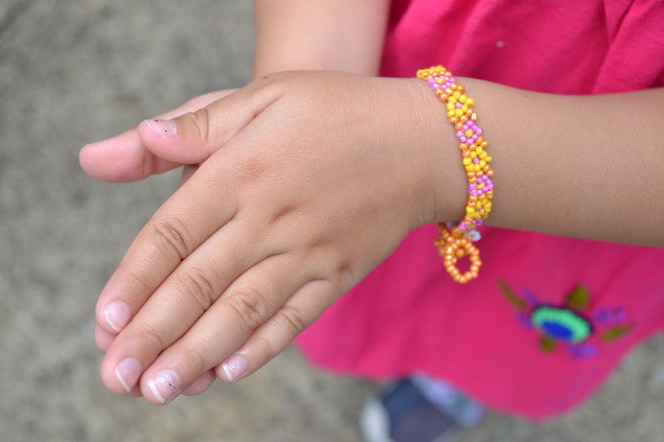 Hand beaded daisy chain fair trade bracelet for kids and tweens